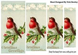 A Lovely Red Robin on Holly Pyramids