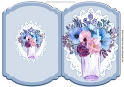 Pretty blue and pink flowers in a glass vase on lace bracket card
