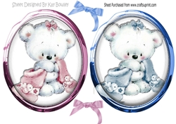 cute cuddly bears in pink and blue toppers with glass and bows