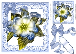 Pretty blue flower in ornate scroll frame with organza bow