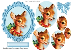 lovely reindeer with spotty bow oval pyramids in ornate frame