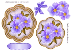 pretty purple flowers on a ornate topper with corner bows