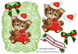 Cute kitten in santa hat on leaf topper with red bow