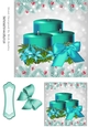 Pretty turq festive candles in holly frame with turq bow 7x7