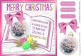 Pretty snow cottage bauble on open book with pink bow 8x8