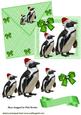 Penguins in Santa Hats on a Green Card and Envelope