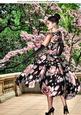 Pretty Girl in Floral Dress in a Garden A4
