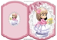 little girl pretty in pink holding a present on lace Bracket card
