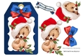 Cute little teddy bear in santa hat with bow (blue) on a tag