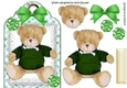 Lovely teddy in a green jumper on lace with bow