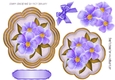 pretty purple flowers on a ornate topper with corner bows