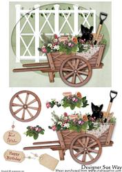 Cat in a Wheelbarrow Full of Flowers