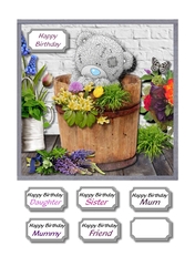Tatty teddy in barrel with flowers