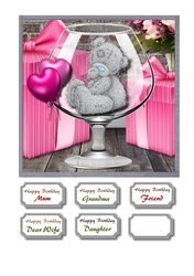 Tatty teddy in brandy glass with gifts