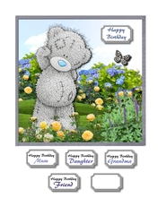 Tatty teddy in flower garden