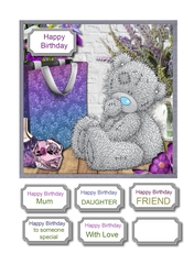 Tatty teddy surrounded by lilac and purple accessories