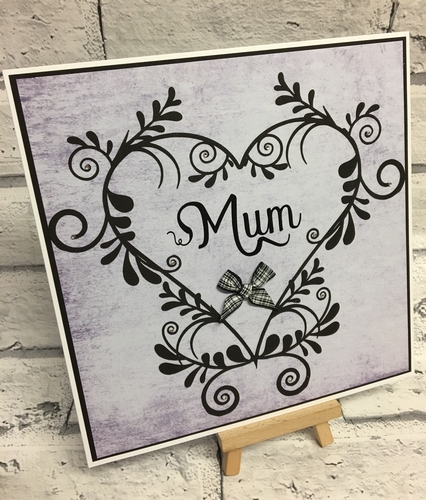 Ornate floral heart shapped topper 