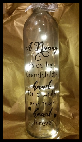 A Nanny Holds her Grandchilds hand for a while  Wine Bottle, light block decal.