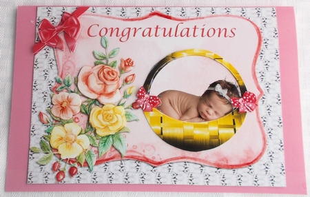 Baby girl in basket by Sharon Wilson