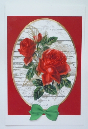 Two Pretty red roses on white washed wood oval toppers by Sharon Wilson
