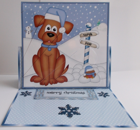 Christmas Rusty Dog is at the North Pole Fan Pyramage Topper by Sharon Wilson