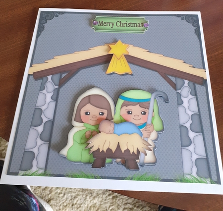 Mary and Joseph with Baby Jesus by Linda Wright