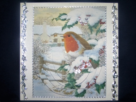 pretty robin sitting on a fence in the snow oval pyramids by Margaret Nichol