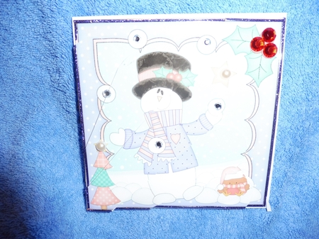 Christmas Snowman Rio has a Snowball Fight Fan Pyramage Topper by Margaret Nichol