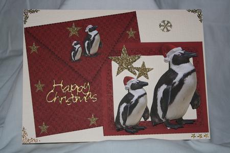 Penguins in Santa Hats on a Card and Envelope by Margaret Nichol