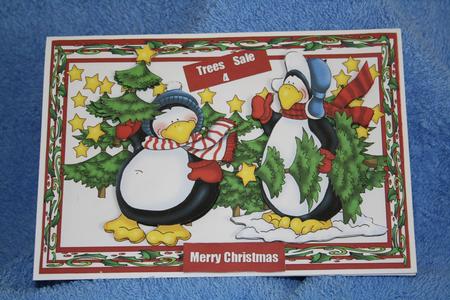 Lovely Penquins Selling the Christmas Trees  by Margaret Nichol