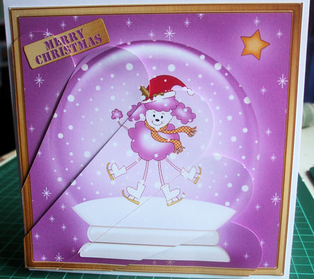 Cute Xmas Poodle Snowglobe Fan Pyramage Topper by Catherine Nelson
