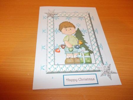 Lovely Little Christmas Boy on Snowflake Backing Paper by Janet Barker