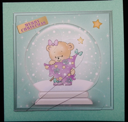 Rosie has a Christmas Tree Snowglobe Fan Pyramage Topper by Irene Woods
