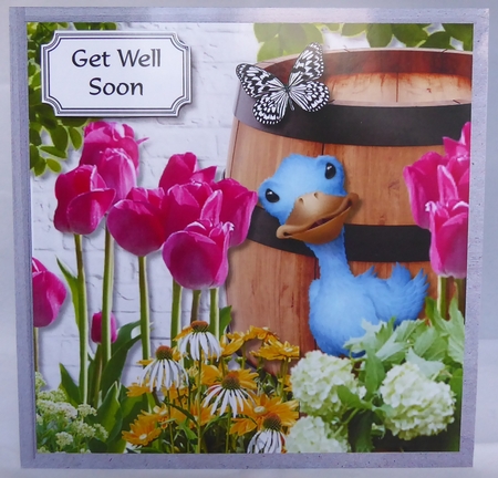 Cute duck amongst the flowers by Irene Woods