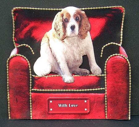 Cavalier King Charles Spaniel in a Christmas Arm Chair by Joyce Watson