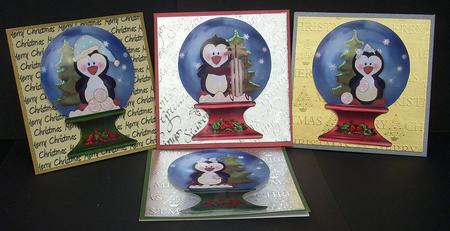 Christmas Frolicking Penguins Snowglobe Toppers by Joyce Watson