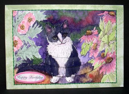 Black & White Tuxedo Cat in the Garden Oval Pyramage by Joyce Watson