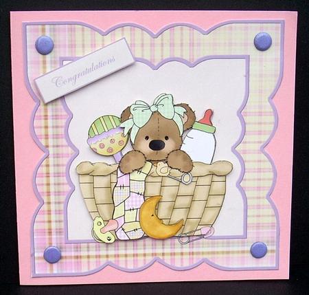 Baby Girl Bear in a Basket Card Front by Joyce Watson