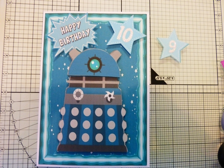 Turq Dalek, with stars in the sky A5 by Alison Tipping