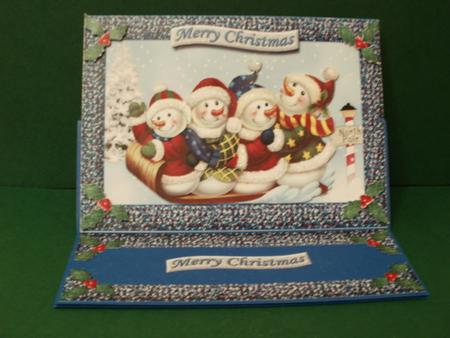 Merry Christmas Sleighing Snowman by Angela Blackmore