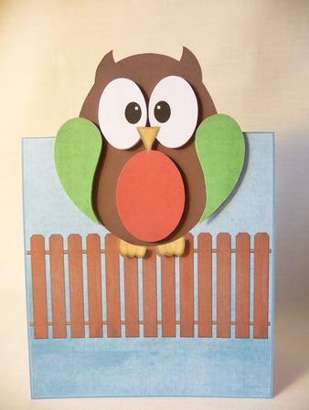 Owl on a Fence Over the Edge by Angela Butters