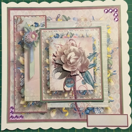 Rose and bauble by Angela Riley