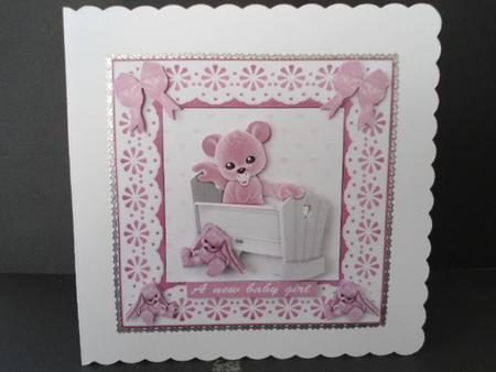 Pink Plushie in a Cradle by Angela Riley