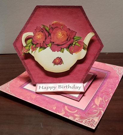 Raspberry Roses on a Teapot Easel by Angela Taylor