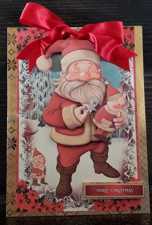 Santa Testing One of his New Toys by Angela Taylor