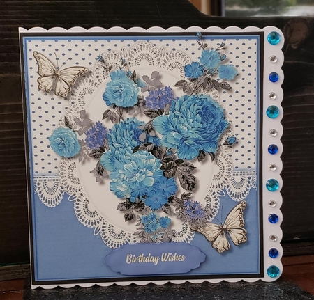 Blue Roses on   lace  by Angela Taylor