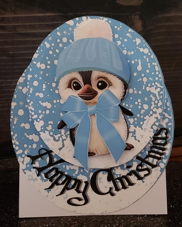 Cute pengy in blue bobble hat rocker card by Angela Taylor