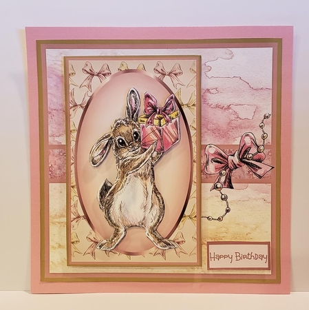 Rabbit brings a gift by Angela Taylor