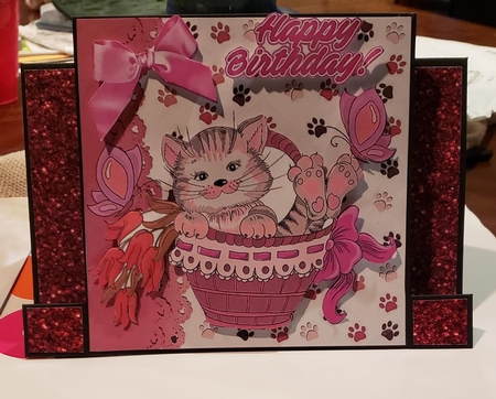 cute kitty in basket with daffodils and purple butterflies 5x5 by Angela Taylor