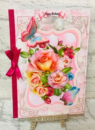 Roses and Butterflies on a Pink Floral Background by Anita Henery